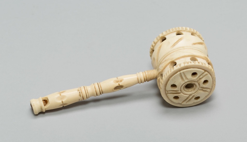 A wooden gavel resting on a desk beside a stack of file folders and a client cost estimate