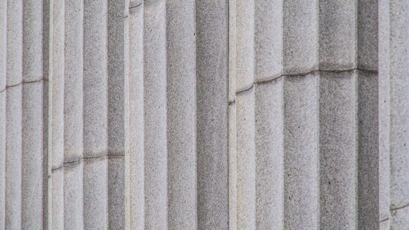 The exterior of a courthouse on a clear day